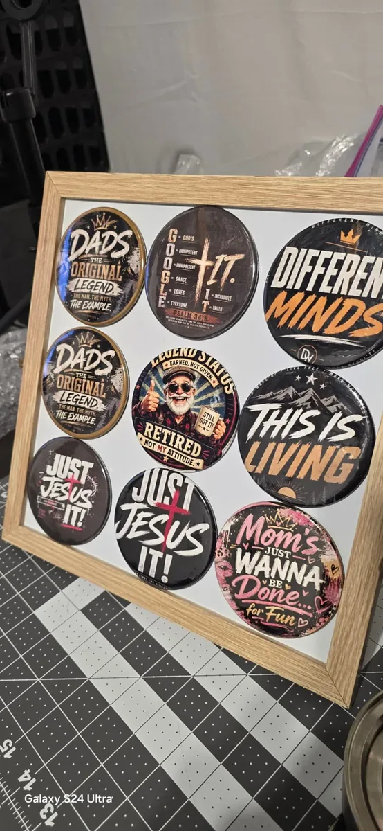Framed display of 3.5 inch custom photo buttons with faith and family sayings made in Yakima, WA